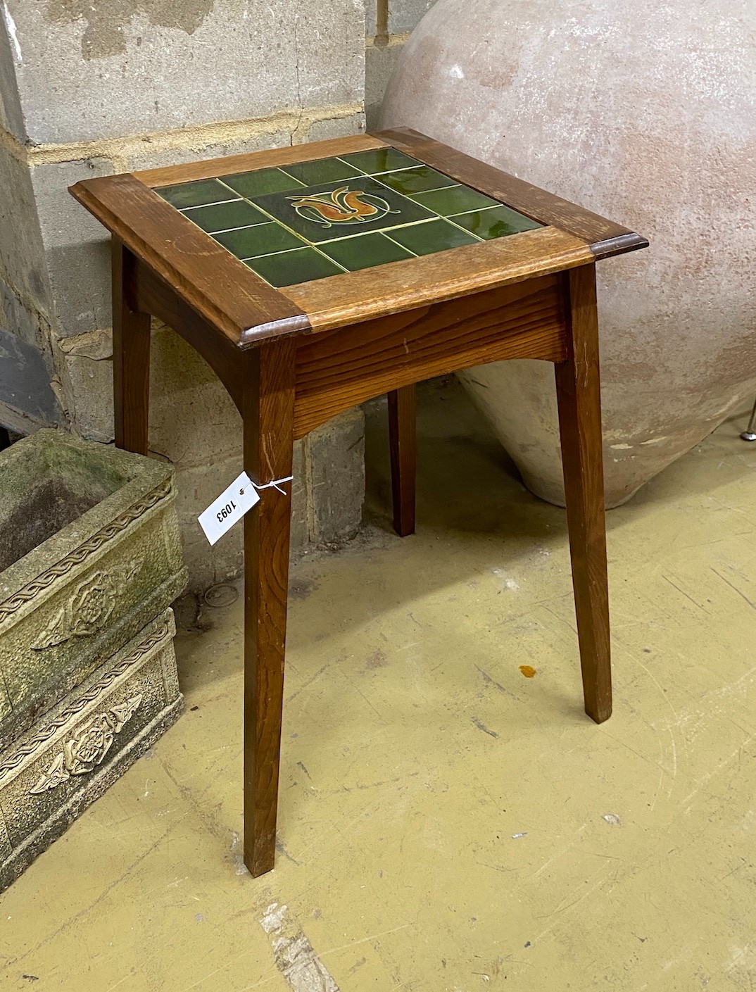 An Edwardian tile top occasional table, width 45cm, height 66cm